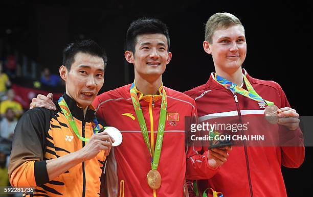 Silver medalist Malaysia's Lee Chong Wei , Gold medalist China's Chen Long , and Bronze medalist Denmark's Viktor Axelsen stand with their meals...