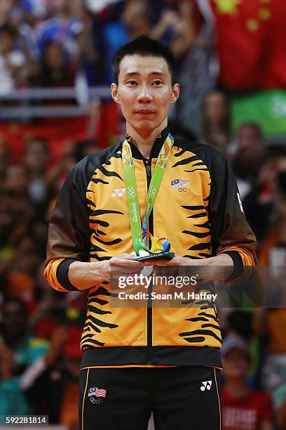 Silver medalist Chong Wei Lee of Malaysia poses on the podium during the medal ceremony for the Men's Singles Badminton on Day 15 of the Rio 2016...