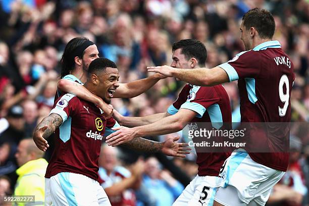Andre Gray of Burnley celebrates scoring his sides second goal with his Burnley team mates during the Premier League match between Burnley and...