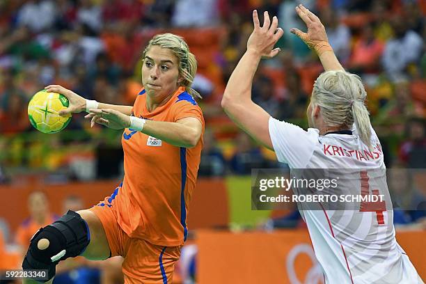 Netherlands' left back Estavana Polman vies with Norway's left back Veronica Kristiansen during the women's Bronze Medal handball match Netherlands...
