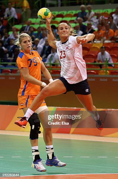 Camilla Herrem of Norway jumps to shoot during the Women's Handball Bronze medal match between Netherlands and Norway at Future Arena on Day 15 of...