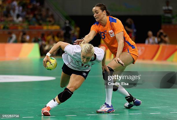 Stine Bredal Oftedal of Norway is chased by Yvette Broch of Netherlands during the Women's Handball Bronze medal match between Netherlands and Norway...