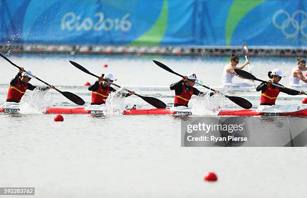 Wenjun Ren of China, Qing Ma of China, Yue Li of China and Haiping Liu of China compete in the Women's Kayak Four 500m on Day 15 of the Rio 2016...