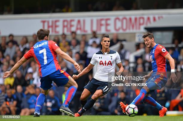 Tottenham Hotspur's Argentinian midfielder Erik Lamela vies with Crystal Palace's French midfielder Yohan Cabaye and Crystal Palace's English...