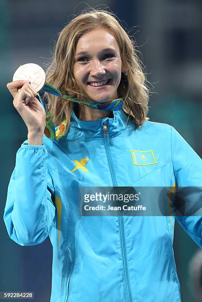 Bronze medalist Olga Rypakova of Kazakhstan poses during the medal ceremony for the Women's Triple Jump on day 10 of the Rio 2016 Olympic Games at...