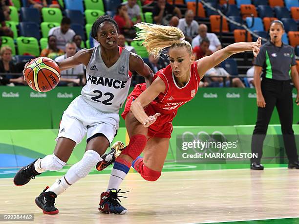 France's point guard Olivia Epoupa vies with Serbia's point guard Milica Dabovic during a Women's Bronze medal basketball match between France and...