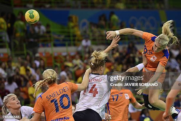 Netherlands' left back Estavana Polman shoots past Norway's left back Veronica Kristiansen during the women's Bronze Medal handball match Netherlands...