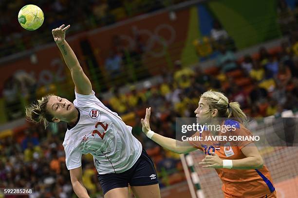 Norway's right wing Amanda Kurtovic vies with Netherlands' left back Estavana Polman during the women's Bronze Medal handball match Netherlands vs...