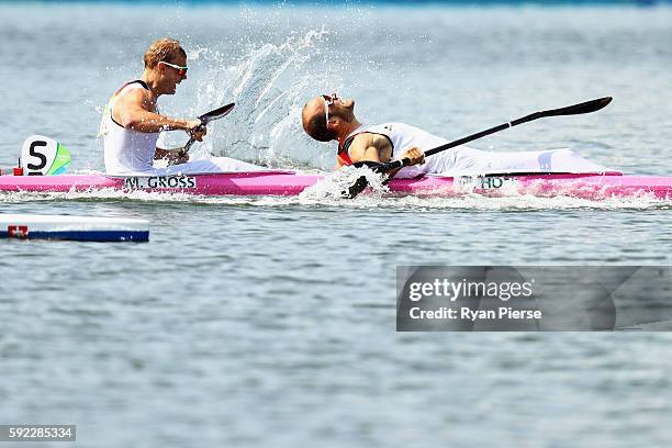 Max Hoff of Germany and Marcus Gross of Germany celebrate winning with team mates Max Rendschmidt of Germany, Tom Liebscher of Germany in the Men's...