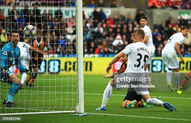 Shaun Maloney of Hull City scores his sides first goal during the Premier League match between Swansea City and Hull City at Liberty Stadium on...