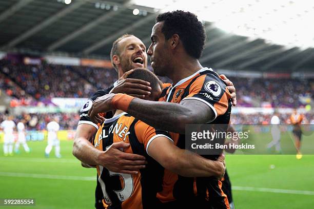 Shaun Maloney of Hull City celebrates scoring his sides first goal with his Hull City team mates during the Premier League match between Swansea City...