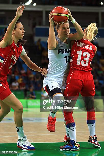 Gaelle Skrela of France drives the ball against Milica Dabovic of Serbia during the Women's Bronze Medal basketball game between France and Serbia on...