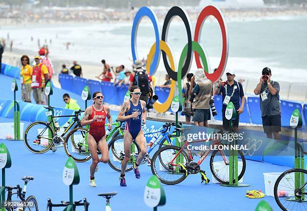 S Gwen Jorgensen and Switzerland's Nicola Spirig compete in the running portion of the women's triathlon at Fort Copacabana during the Rio 2016...