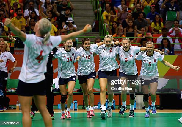 Norway players celebrate their victory following the Women's Handball Bronze medal match between Netherlands and Norway at Future Arena on Day 15 of...