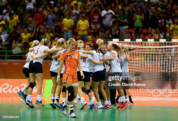 Norway players celebrate their victory while Estavana Polman of Netherlands looks dejected following the Women's Handball Bronze medal match between...