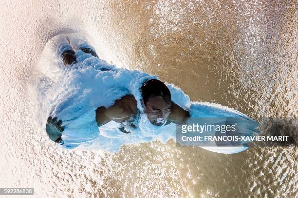 Picture taken with an underwater camera shows Britain's Thomas Daley competing in the Men's 10m Platform Semifinal during the diving event at the Rio...