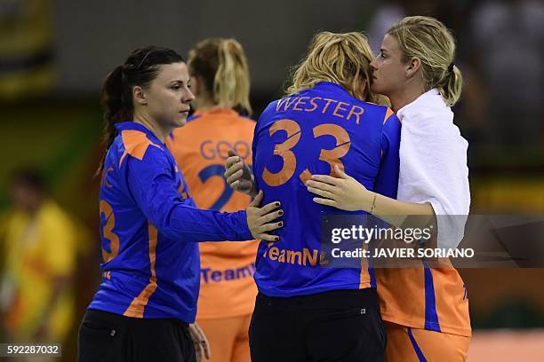 Netherlands' left back Estavana Polman , Netherlands' goalkeeper Tess Wester and Netherlands' goalkeeper Jasmina Jankovic react after being defeated...
