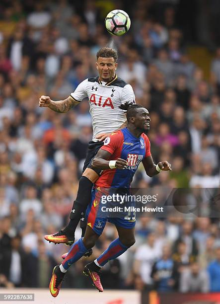 Kyle Walker of Tottenham Hotspur and Pape N'Diaye Souaré of Crystal Palace battle for possession in the air during the Premier League match between...