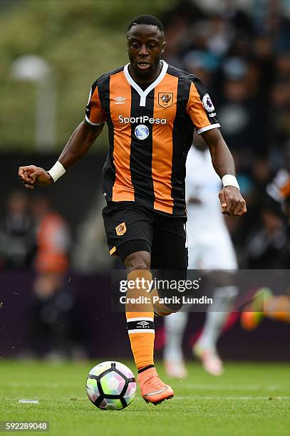 Moses Odubajo of Hull City runs with the ball during the Premier League match between Swansea City and Hull City at Liberty Stadium on August 20,...