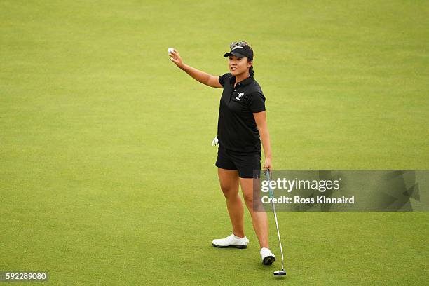 Lydia Ko of New Zealand reacts after putting for birdie on the 18th green to win silver during the Women's Golf Final on Day 15 of the Rio 2016...