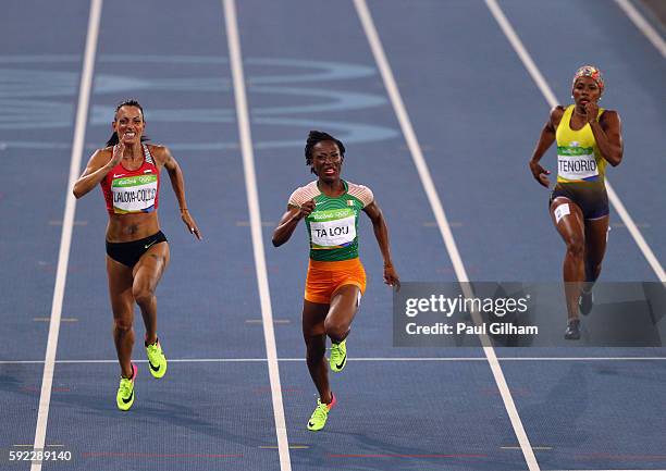 Ivet Lalova-Collio of Bulgaria, Marie-Josee Ta Lou of the Ivory Coast and Angela Tenorio of Ecuador compete during the Women's 200m on Day 11 of the...