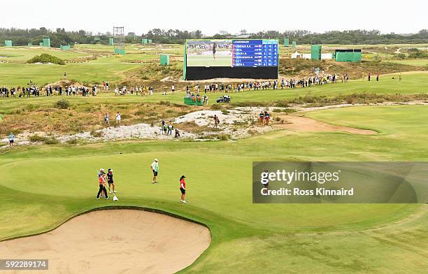 Lydia Ko of New Zealand reacts after putting for birdie on the 18th green to win silver during the Women's Golf Final on Day 15 of the Rio 2016...