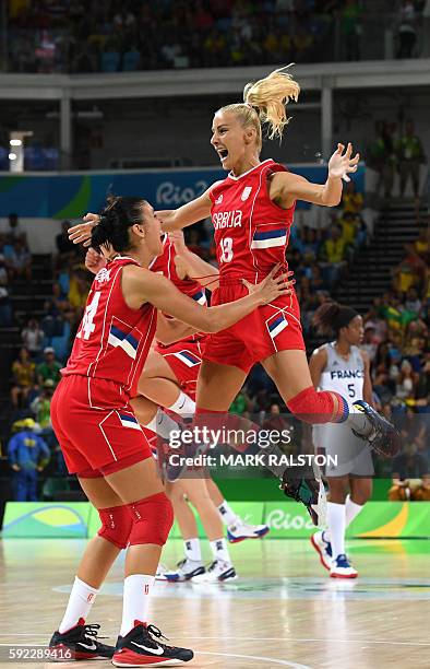 Serbia's shooting guard Ana Dabovic celebrates with Serbia's point guard Milica Dabovic after winning a Women's Bronze medal basketball match between...