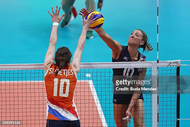 Jordan Larson-Burbach of United States spikes the ball against Lonneke Sloetjes of Netherlands during the Women's Bronze Medal Match between...