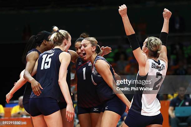 Jordan Larson-Burbach, Kimberly Hill, Kayla Banwarth and Foluke Akinradewo of United States celebrate a point during the Women's Bronze Medal Match...