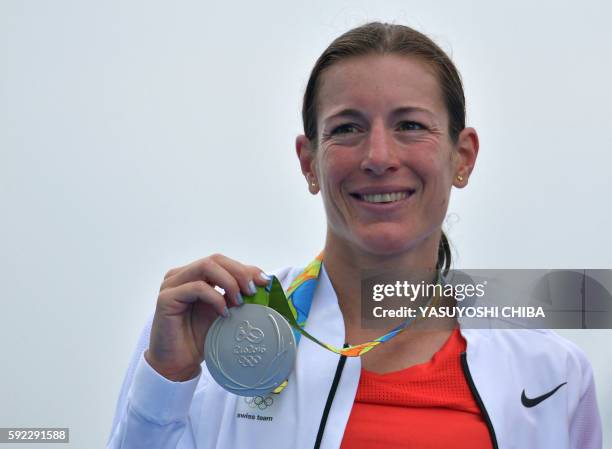 Switzerland's Nicola Spirig receives her silver medal on the podium after the women's triathlon at Fort Copacabana during the Rio 2016 Olympic Games...