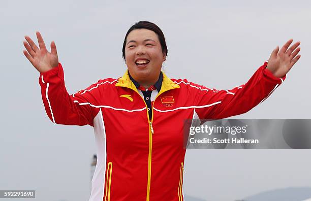 Bronze medalist, Shanshan Feng of China poses on the podium during the medal ceremony for Women's Golf on Day 15 of the Rio 2016 Olympic Games at the...