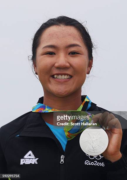 Silver medalist, Lydia Ko of New Zealand, poses on the podium during the medal ceremony for Women's Golf on Day 15 of the Rio 2016 Olympic Games at...