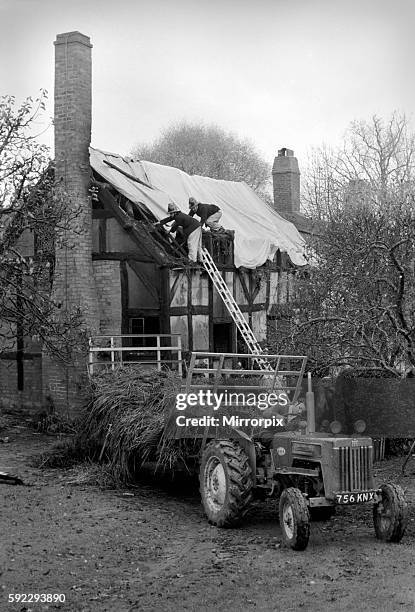 Scene today at Anne Hathaways Cottage, Stratford Upon avon as firemen cover the roof after extensive fire damage during the night November 1969...