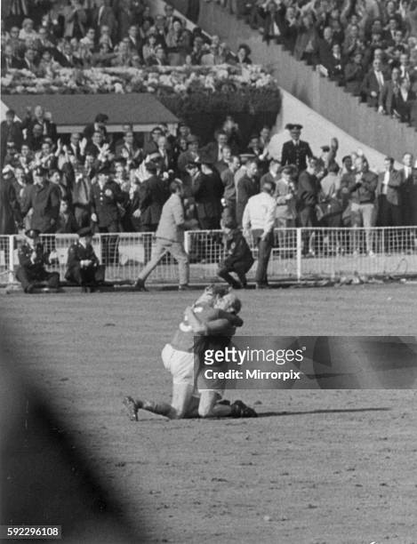 World Cup Final at Wembley Stadium. England 4 v West Germany 2 after extra time. England brothers Jack and Bobby Charlton sink to their knees as they...