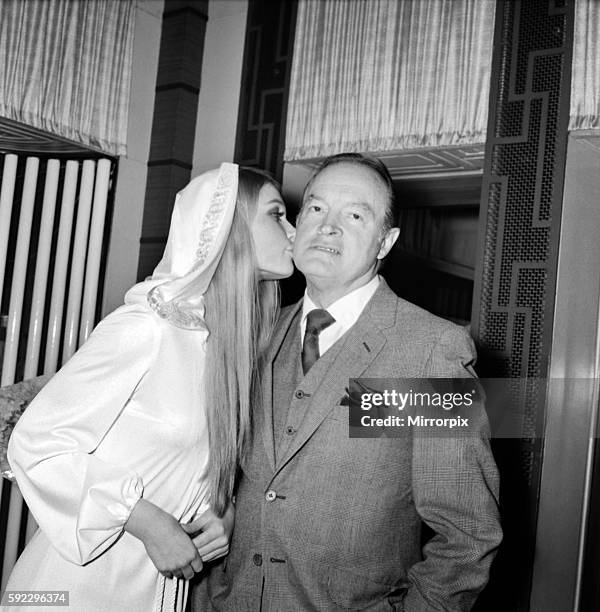 Film actor Bob Hope opens 'how to commit marriage' at The New Victoria Theatre. Bob Hope gets a kiss from Miss World, Eva Rueber-Staier. December...
