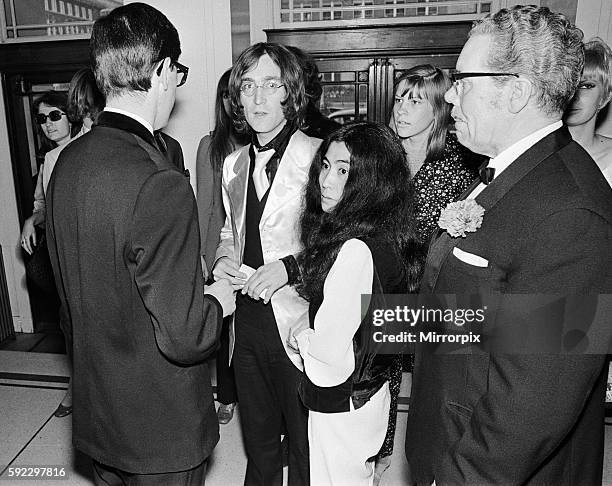 John Lennon and Yoko Ono on their first public appearance together attended the opening of the National Theatre production of In His Own Write...