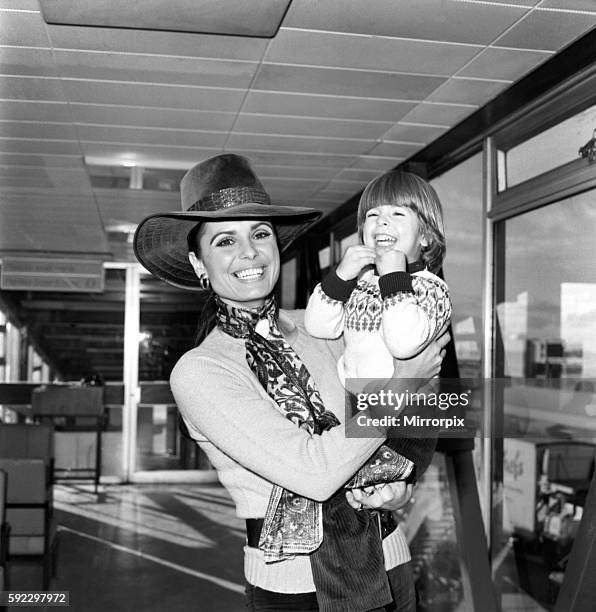 Film actress Dahlia Lavi and her 2 year old son Rouven, pictured together at London Airport today before leaving to spend Christmas with her mother...