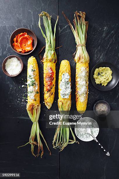 grilled corn with toppings - corn cob stock pictures, royalty-free photos & images