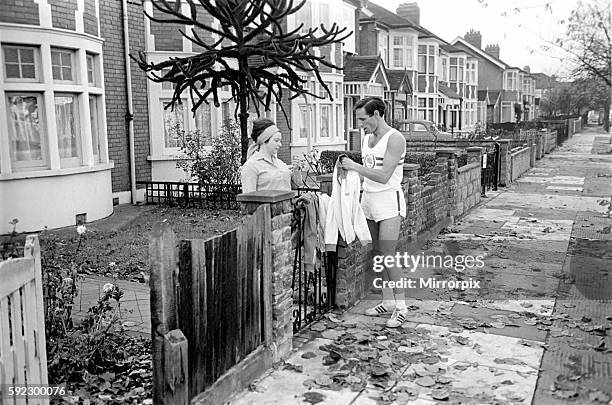 Ron Jone 100 metre sprinter for England and his Club the Enfield and Haringay Hamers seen here training on the leafy Streets of Enfield. 1965...