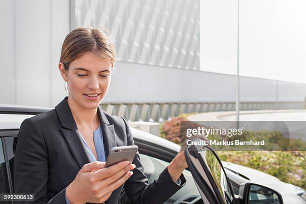 business woman checking short message - auto transmission stock-fotos und bilder