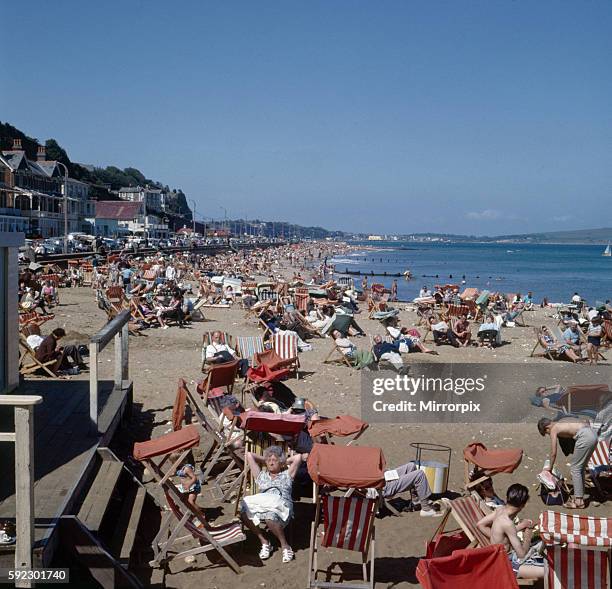 Busy scenes on the beach in the town of Shanklin on the Isle of Wight, June 1965.