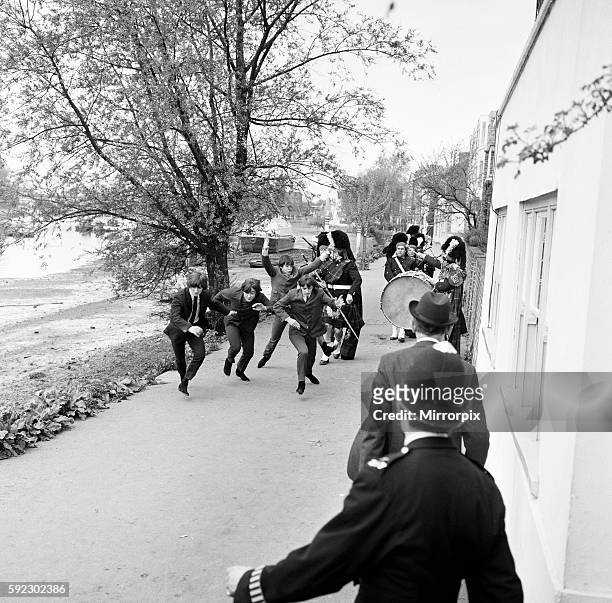 The Beatles film scenes for new film 'Help!' near The City Barge, Strand-on-the-Green, Chiswick, London, Saturday 24th April 1965. Being chased by...