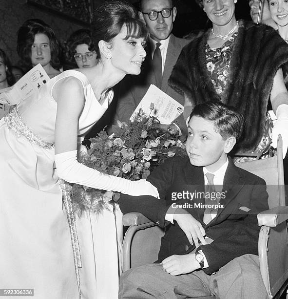 Actress Audrey Hepburn meets 14 year old Stephen reid from Chesham, Buckinghamshire at the London premiere of her latest movie "Breakfast At...