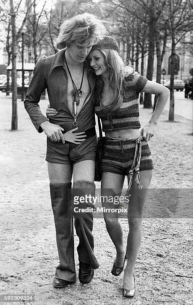 The man is Luthje Reinhard wearing shorts-Jumpsuit with detachable trouser legs by Loris Azzaro . Belt with metal hand by Loris Azzaro. January 1971...