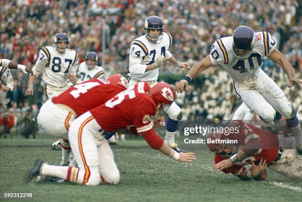 Kansas City's Remi Prudhomme lower right, recovers a fumble by Minnesota's Charlie West on the Viking's 19 yard line in second quarter of Super Bowl...