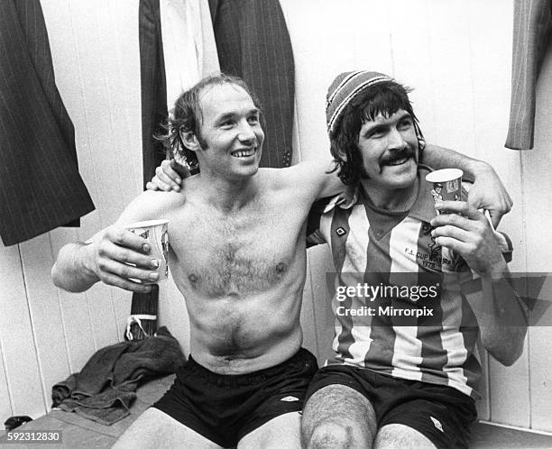 Bryan Robson & Billy Hughes Sunderland football players celebrate in changing room after clinching 2nd Division title at Roker Park April 1976. Final...