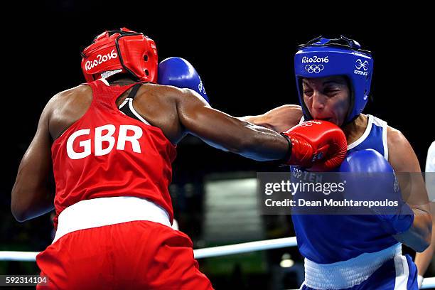 Nicola Adams of Great Britain and Sarah Ourahmoune of France in action during the Women's Fly Final Bout on Day 15 of the Rio 2016 Olympic Games at...