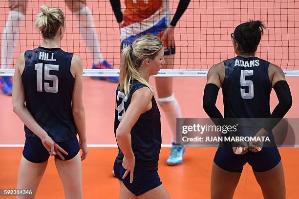 S Kimberly Hill, USA's Karsta Lowe and USA's Rachael Adams signal to their teammates during the women's bronze medal volleyball match between the...