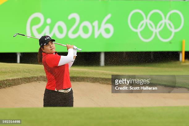 Inbee Park of Korea plays a shot from a bunker on the 18th hole during the Women's Golf Final on Day 15 of the Rio 2016 Olympic Games at the Olympic...