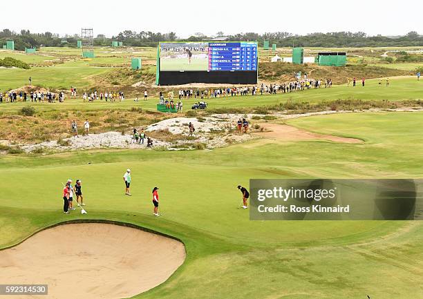 Lydia Ko of New Zealand putts for birdie on the 18th green to win silver during the Women's Golf Final on Day 15 of the Rio 2016 Olympic Games at the...